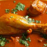 Chicken Vindaloo · Chicken cooked with potatoes, vinegar and spicy tomato sauce