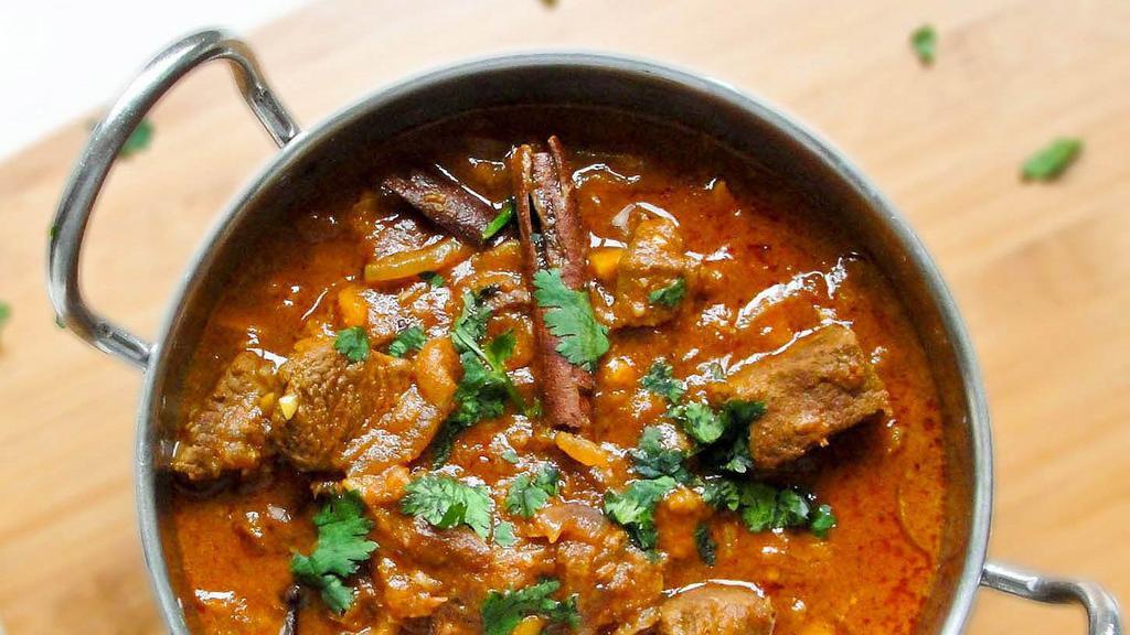 Goat Curry · Goat  (Bone in) meat cooked in blend of spices