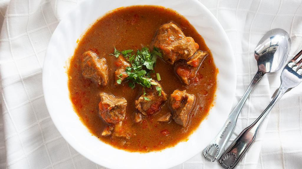 Lamb Curry · Boneless lamb cooked in a blend of spices.
