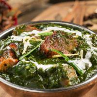 Palak Gosht · Boneless lamb cooked with spinach and spices.