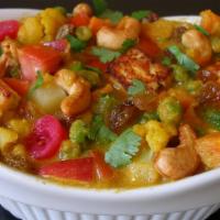 Navratan Korma · Variety of mixed vegetables cooked in a creamy tikka masala sauce with mixed nuts.