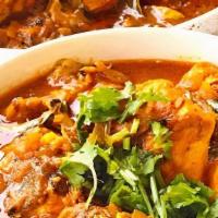 Fish Curry · Tandoori fish cooked in a blend of spices.