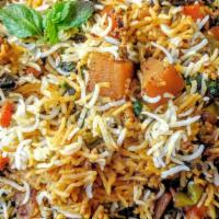 Vegetable Biryani · Stir-fried rice with mixed vegetables in a blend of biryani spices.
