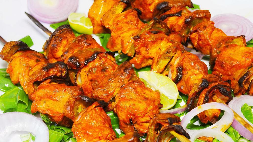 Chicken Tikka Kabab · Boneless marinated chicken cubes cooked in a clay oven.