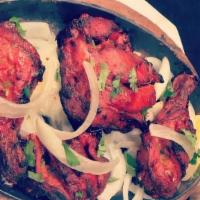 Chicken leg Tandoori · 2 pieces.Marinated chicken leg cooked in a clay oven.