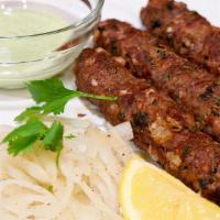 Lamb Seekh Kabab · 2 pieces. Ground lamb marinated and cooked in a clay oven on skewers.