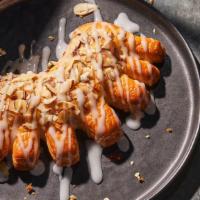 Bear Claw · 500 Cal. Freshly baked pastry made with an almond filling and drizzled with icing and sliced...