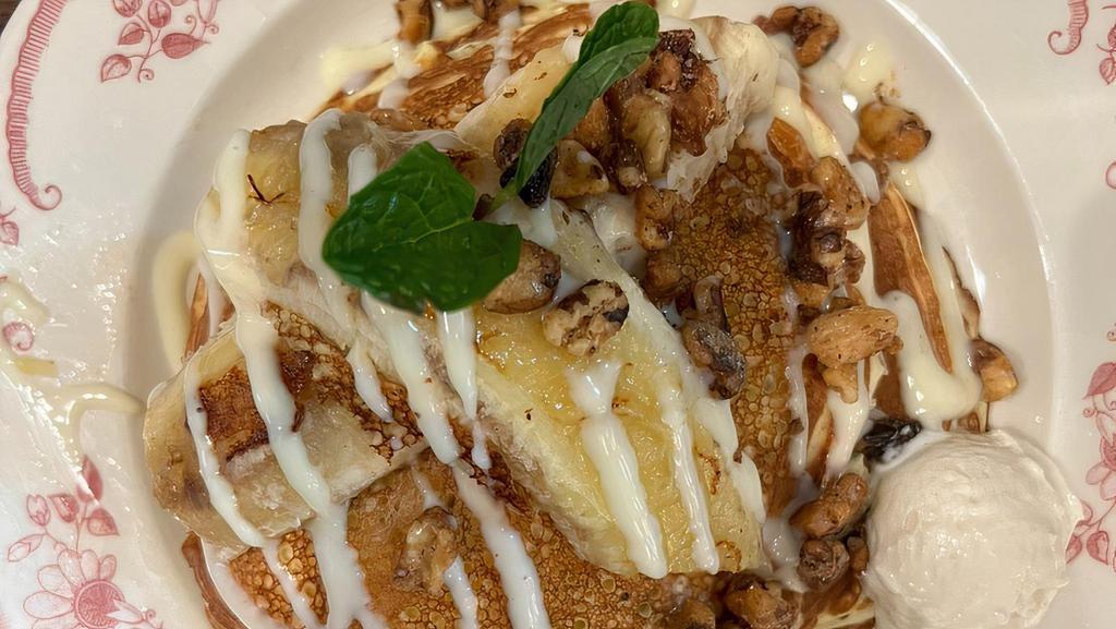 Banana Mascarpone Souffle Pancake · Mascarpone flour, vanilla curd, fried banana and candied walnut.