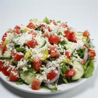 Greek Salad (Family) · Green leaves, feta cheese, tomato, red onion, pepperoncini, cucumber.