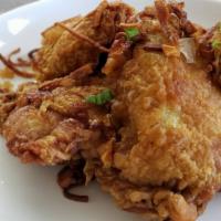 Crispy Fried Chicken Thighs · Flavorful, well marinated chicken legs and thighs served with fried shallots. Served with fr...