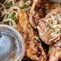 Combo Thighs · Crispy fried chicken thighs with garlic noodle free one soda