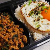Combo Thai Pork Basil Rice · Hot. Thai Spicy Pork Basil with rice and fried egg topped with seaweed seasoning free one soda