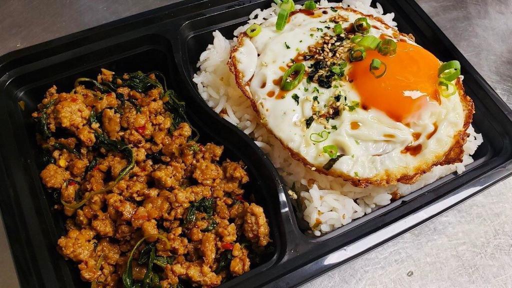 Combo Thai Pork Basil Rice · Hot. Thai Spicy Pork Basil with rice and fried egg topped with seaweed seasoning free one soda