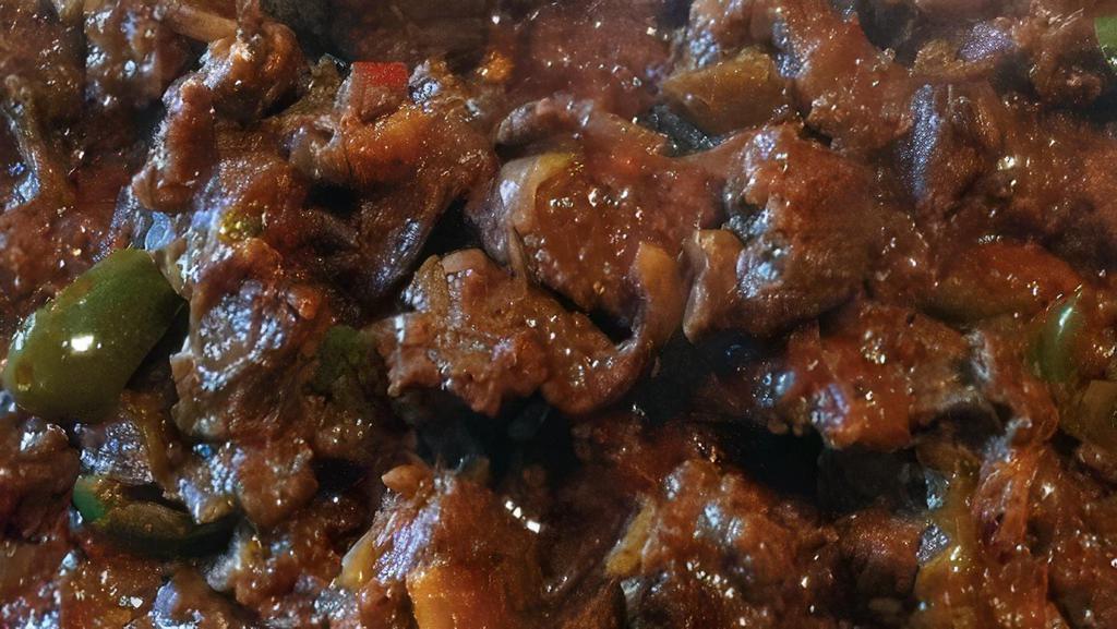 12. Awaze Tibs · Stripes of beef sautéed in seasoned butter hot peppers, onions.