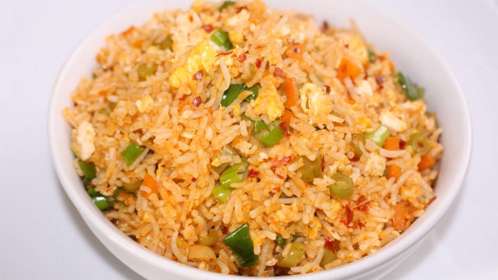 Schezwan Fried Rice - Egg · Schezwan Fried Rice is a vibrant, spicy, tasty and popular Indo Chinese recipe of stir-fried vegetables and rice with schezwan sauce.
