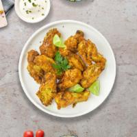 Lemon Pepper Wings · Fresh chicken wings, fried until golden brown, and tossed in lemon pepper sauce. Served with...