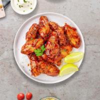Honey BBQ Wings · Fresh chicken wings, fried until golden brown, and tossed in honey and barbecue sauce. Serve...