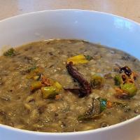 Vegan Black Dal/Lentil Tadka · Black lentils tempered with spices topped with Himalayan herbs. Comes with Rice.