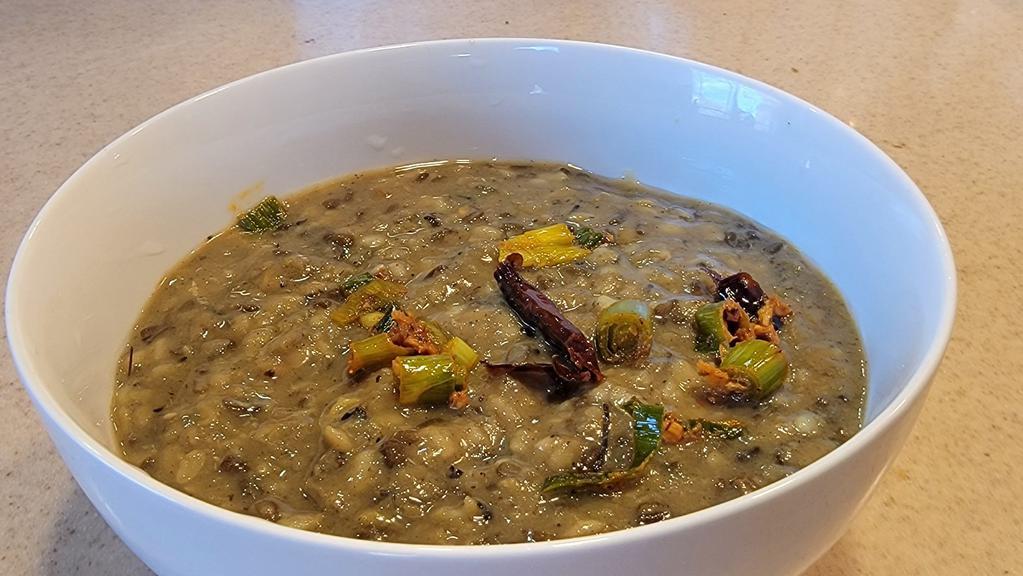 Vegan Black Dal/Lentil Tadka · Black lentils tempered with spices topped with Himalayan herbs. Comes with Rice.