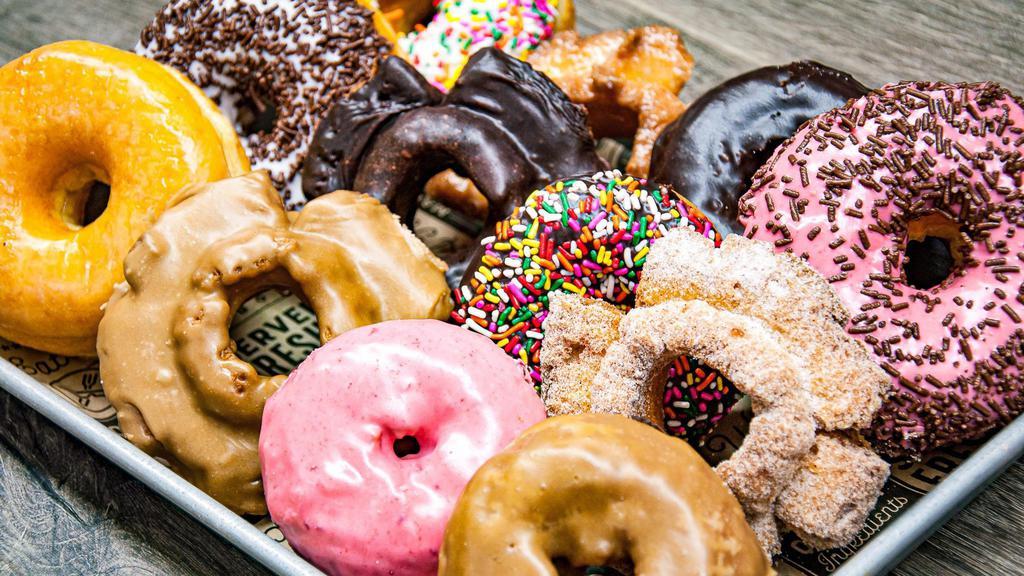 Mixed Dozen Regular Donuts · Assorted donuts raised, cakes, and old fashioned. No specialty donuts. We just mix a variety of donuts for you no special request sorry.