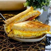 Egg & Cheese · Scrambled eggs and cheese on bread.