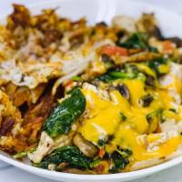 Tofu Scramble · Grilled spinach, mushroom, tomato w/ tofu and topped with shredded cheddar and sourcream. Se...