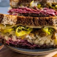 Dirty Ruby · Grilled marble rye, pepperoncini, pastrami, sauerkraut, Swiss, Pepper Jack and Cheddar with ...
