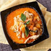 Red Curry · Red curry with Thai spices, coconut milk, pumpkins, bamboo shoots and basil.
