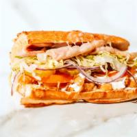 #01. King Louie · Honey ham, breaded chicken patties, swiss cheese, garlic-pesto sauce, mayonnaise, lettuce, t...