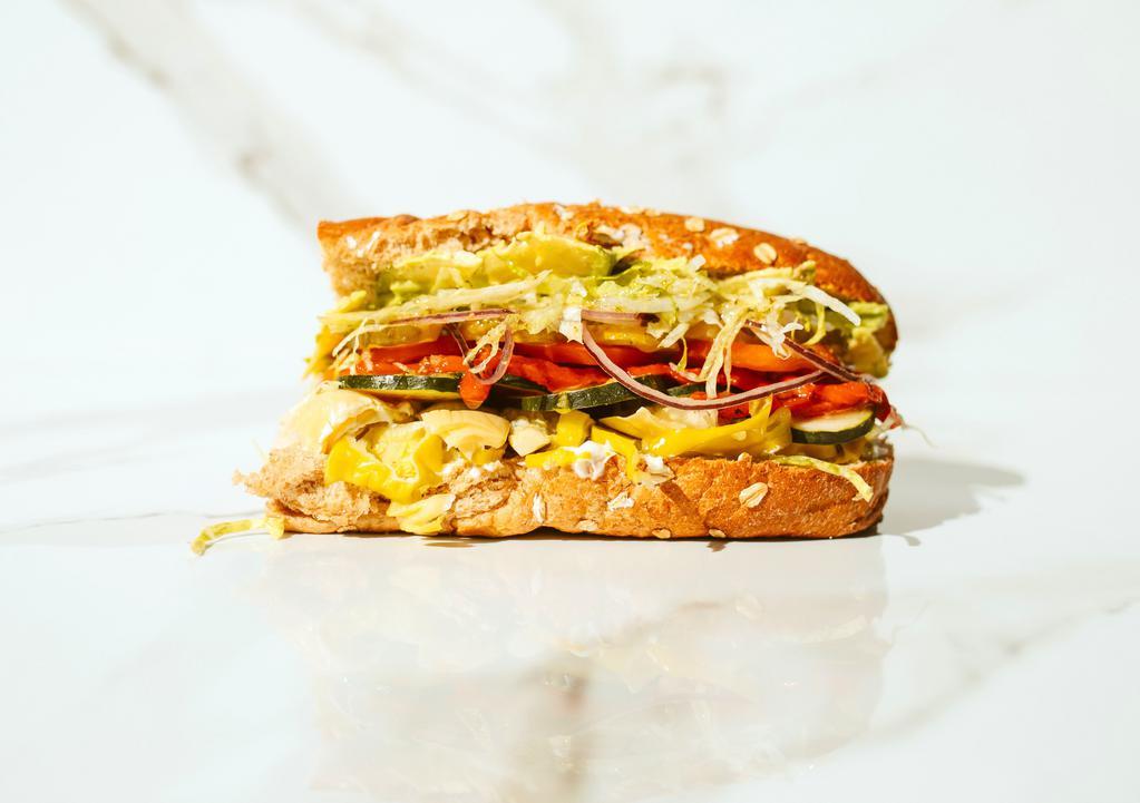 #11. Goodall · Artichoke hearts, roasted red peppers, avocado, pepperoncinis, cucumbers, garlic sauce, mayonnaise, mustard, lettuce, tomatoes, pickles and onions.