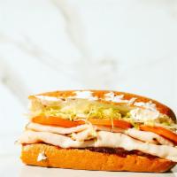 #08. Harvest Monkey · Turkey, cream cheese, cranberry sauce, lettuce and tomatoes.