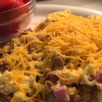 Bill Sinodino's Scramble · Diced linguica, hash browns or country potatoes, eggs and jalapenos, topped with cheese. Ser...