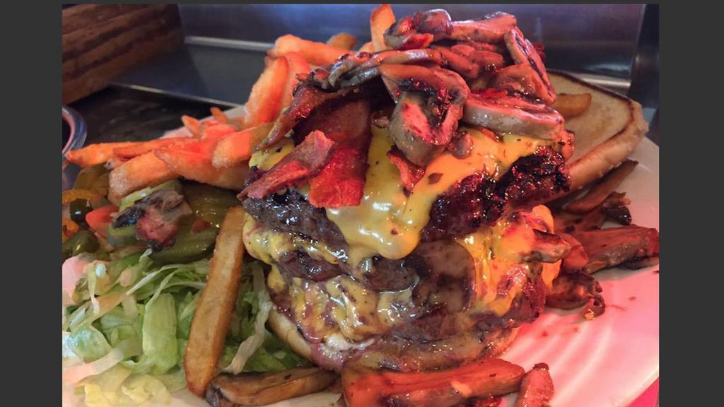 We Dare-You-To-Try Burger · It's a TRIPLE hamburger patty, bacon, jalapenos, mushroom, grilled  onions and cheese...YOU DARE?