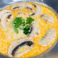 #J15 Tom Kha · Spicy coconut milk soup with lemongrass, galanga, mushroom, lemon juice, and coconut milk.