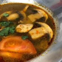#J14 Tom Yum · Spicy and sour soup with lemongrass, galanga, tomato, and mushrooms.