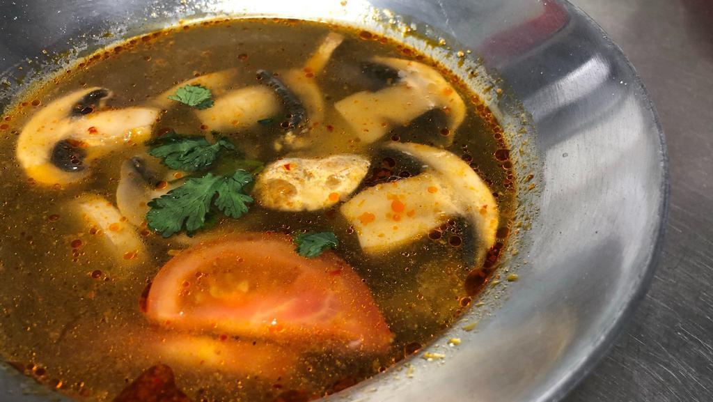 #J14 Tom Yum · Spicy and sour soup with lemongrass, galanga, tomato, and mushrooms.