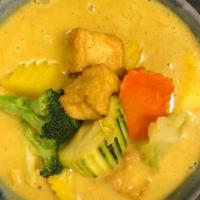 #J42 Kabocha Squash Curry · Kabocha squash simmered with mild yellow curry, carrot, and coconut milk.