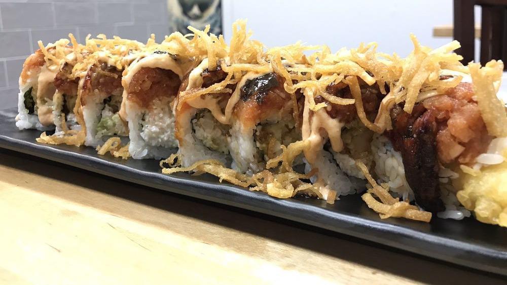 Godzilla Roll · inside - shrimp tempura, crab, avocado
outside - spicy tuna, eel, miso honey sauce, eel sauce, scallion, wonton chips