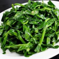 Stir-Fried Pea Leaves with Garlic · Vegetarian.