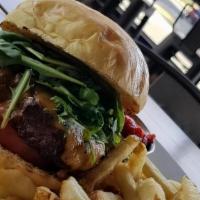 Lokal Burger · All natural grass-fed beef, lettuce, tomato, onions, on a brioche bun