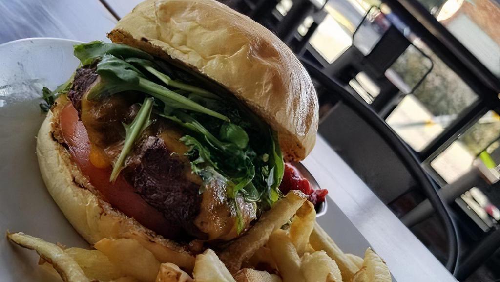 Lokal Burger · All natural grass-fed beef, lettuce, tomato, onions, on a brioche bun