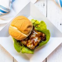 Grilled Chicken Sandwich · Sauteed boneless chicken thigh over lettuce topped with colby jack cheese on a toasted brioc...
