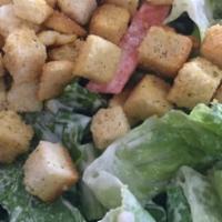 Chicken Caesar Salad · Romaine lettuce, carrots, chicken, croutons, and Caesar dressing
