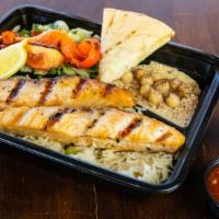 7. Grilled Salmon · comes w/rice,salad ,hummus and Pita