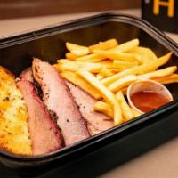 Tri Tip Combo Meal · Smoked Tri Tip Boxed Meal - Includes choice of side, garlic bread, sauce and fixins