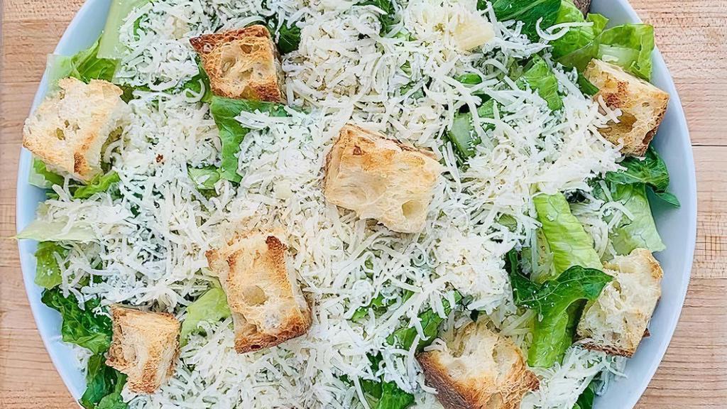 Regular Traditional Caesar Salad · romaine, croutons, cracked pepper, parmigiano reggiano, caesar dressing **regular salad for one full serving or 2 small salads**  Served with 2 ounces of dressing, tossed or on the side.