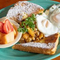 Sundeck Combo A · Eggs benedict, French toast, fruit salad and home fries.
