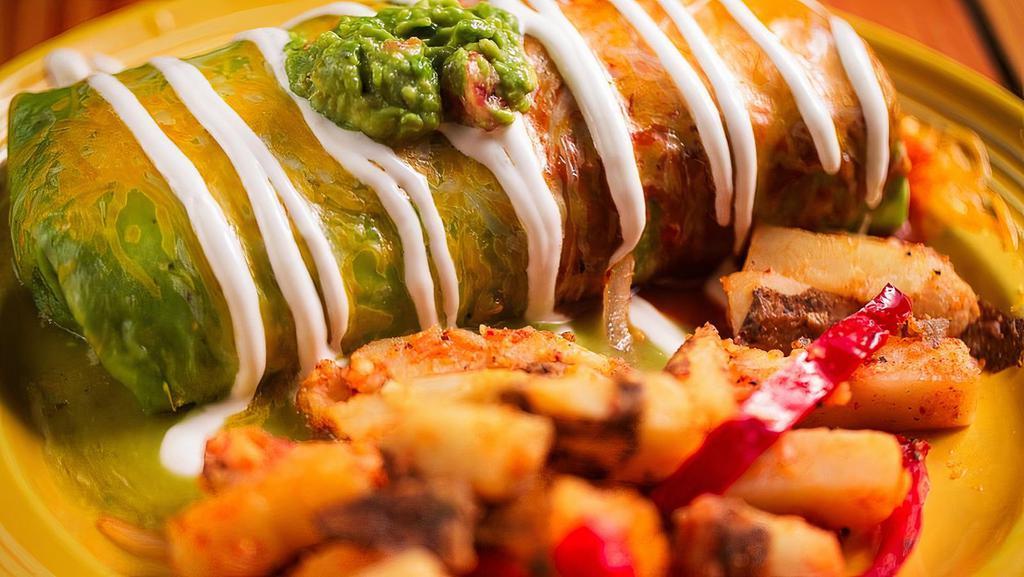 Breakfast Burrito · Scrambled eggs, rice, beans, cheese with guacamole and sour cream on top. Served with home fries.