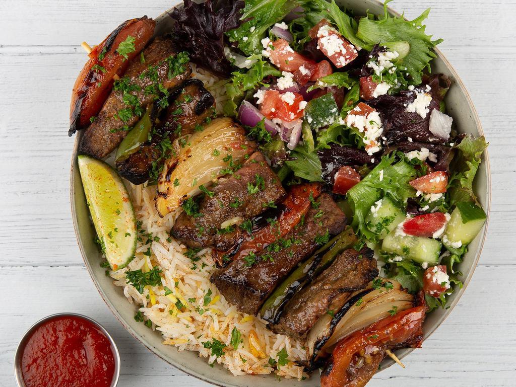 Beef Gyro Plate · Tender beef gyro served with basmati rice, side salad, fresh pita and your choice of sauce.