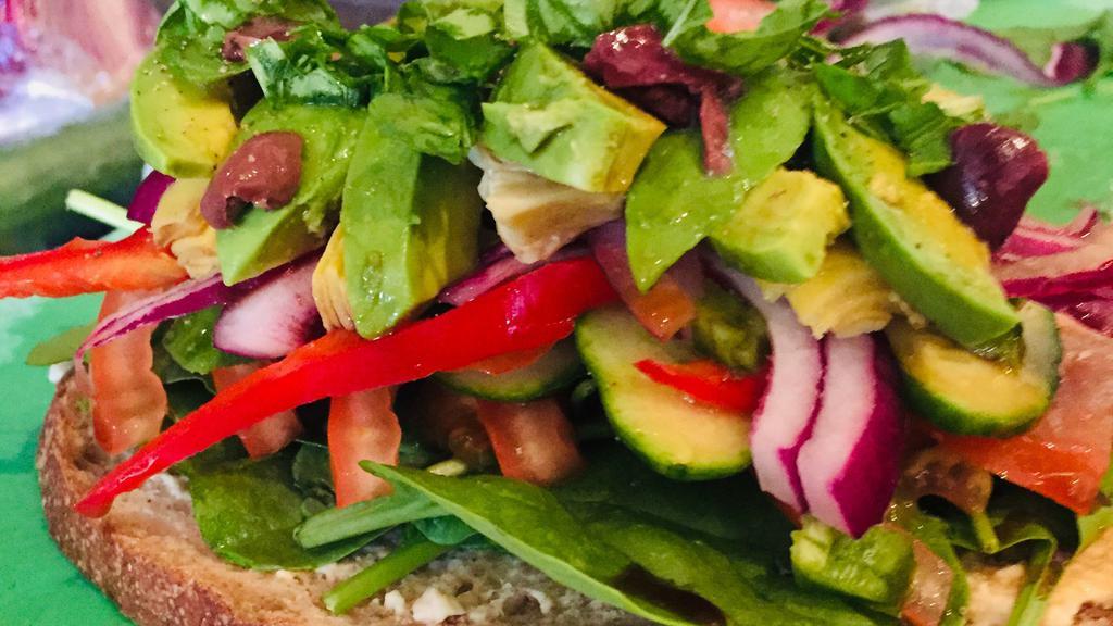 Garden Vegetarian Sandwich · Hummus, spinach, cucumber, tomato, olives, avocado, red onion, roasted peppers, basil, freshly ground black pepper, and feta cheese.